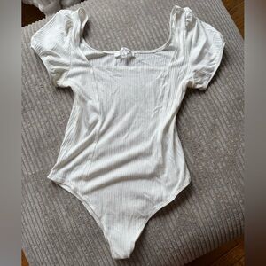 Elegant White Ribbed Bodysuit